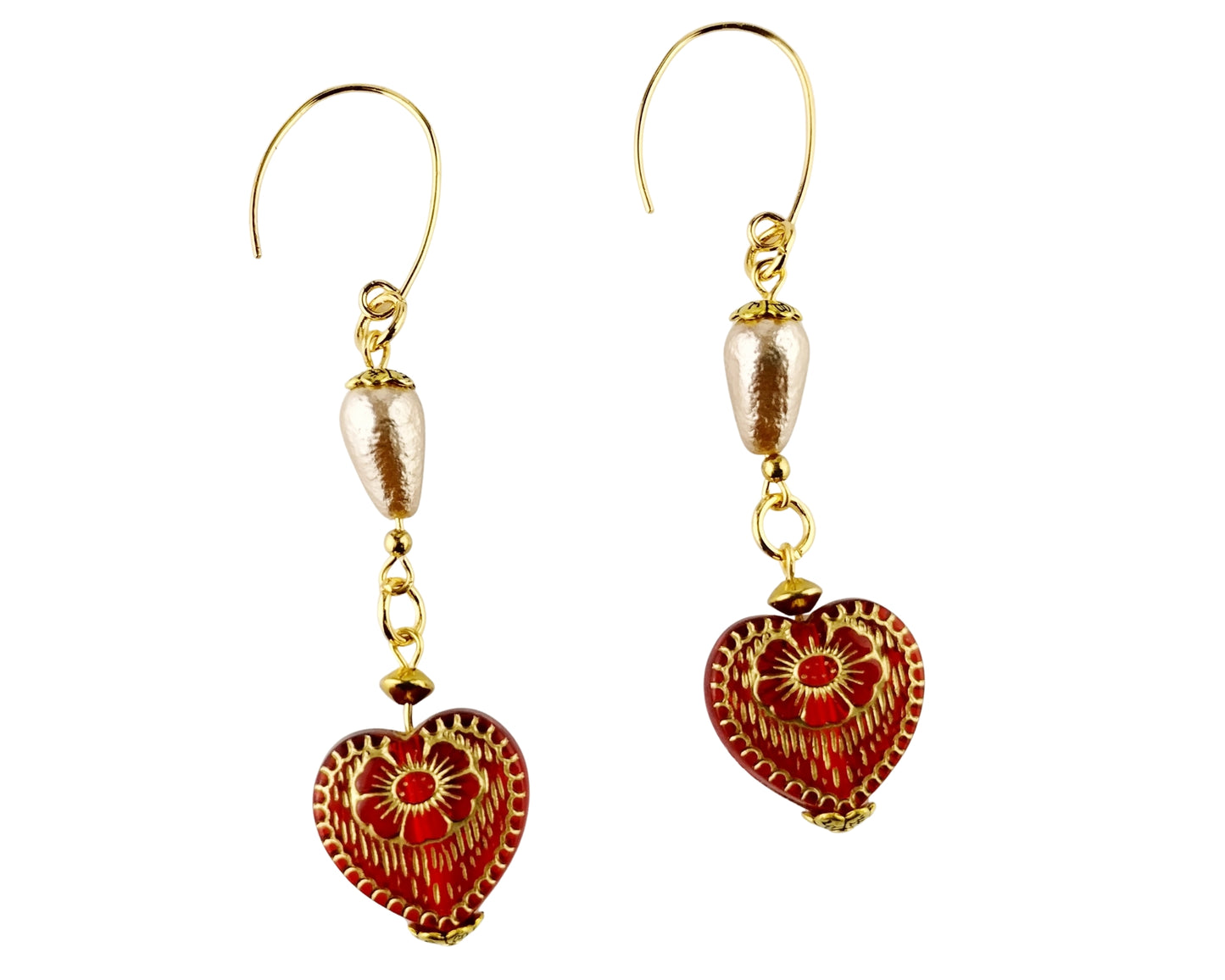 Pair of gold and red heart-shaped earrings on a white background
