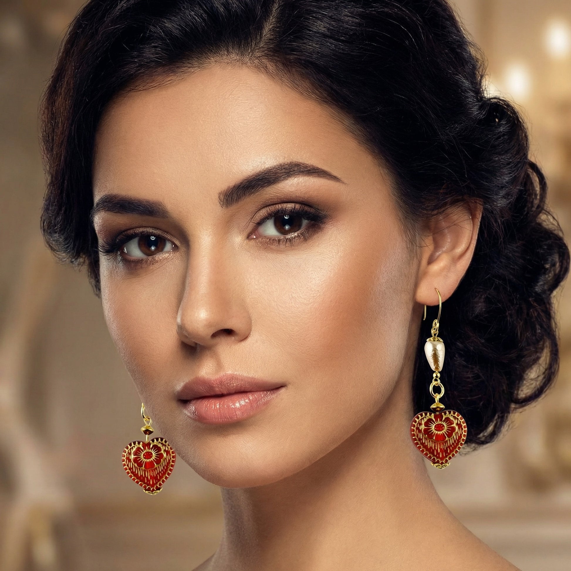 Close-up of a woman wearing ornate heart-shaped earrings with a blurred background