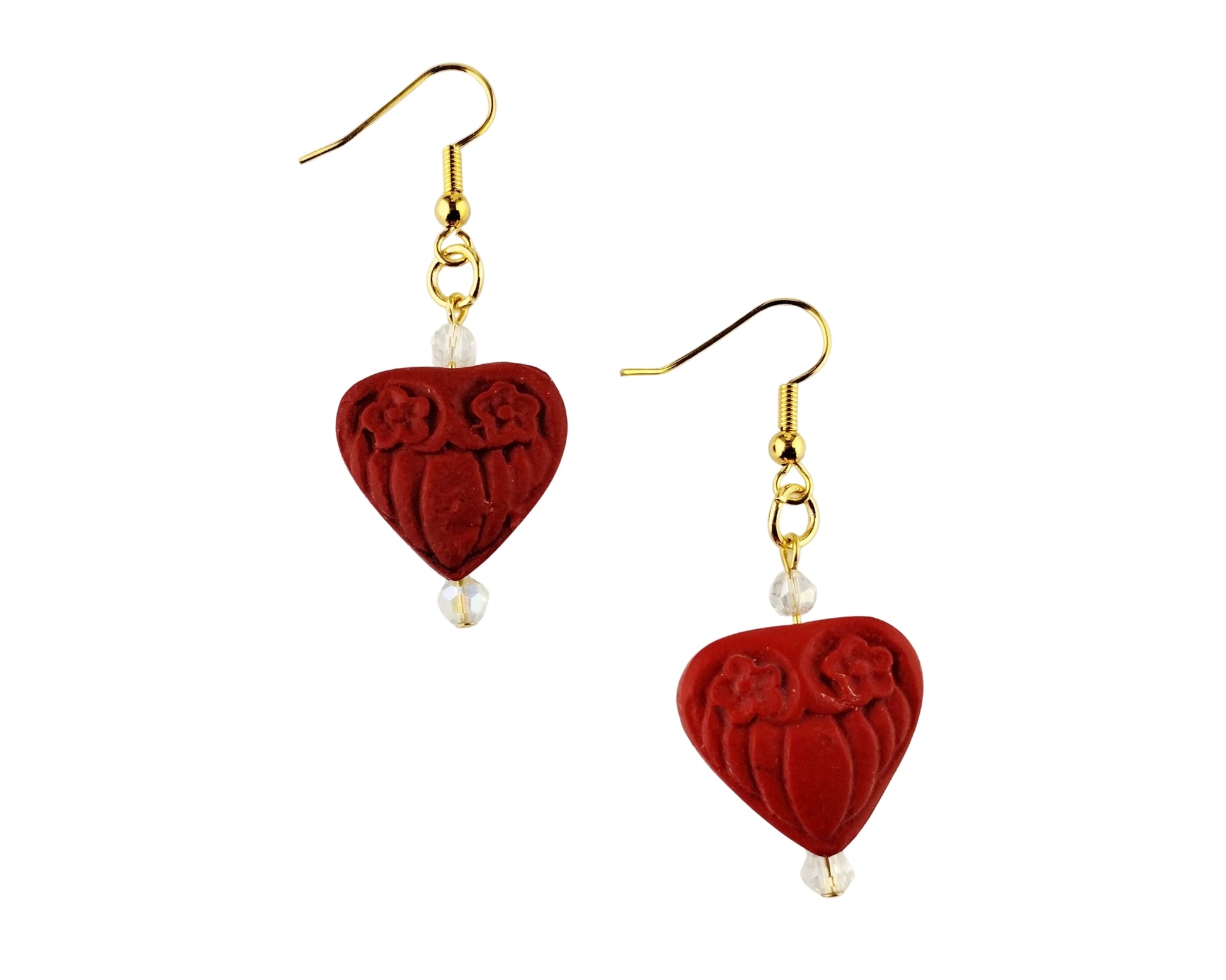 Red heart-shaped earrings with gold hooks and clear beads on a white background