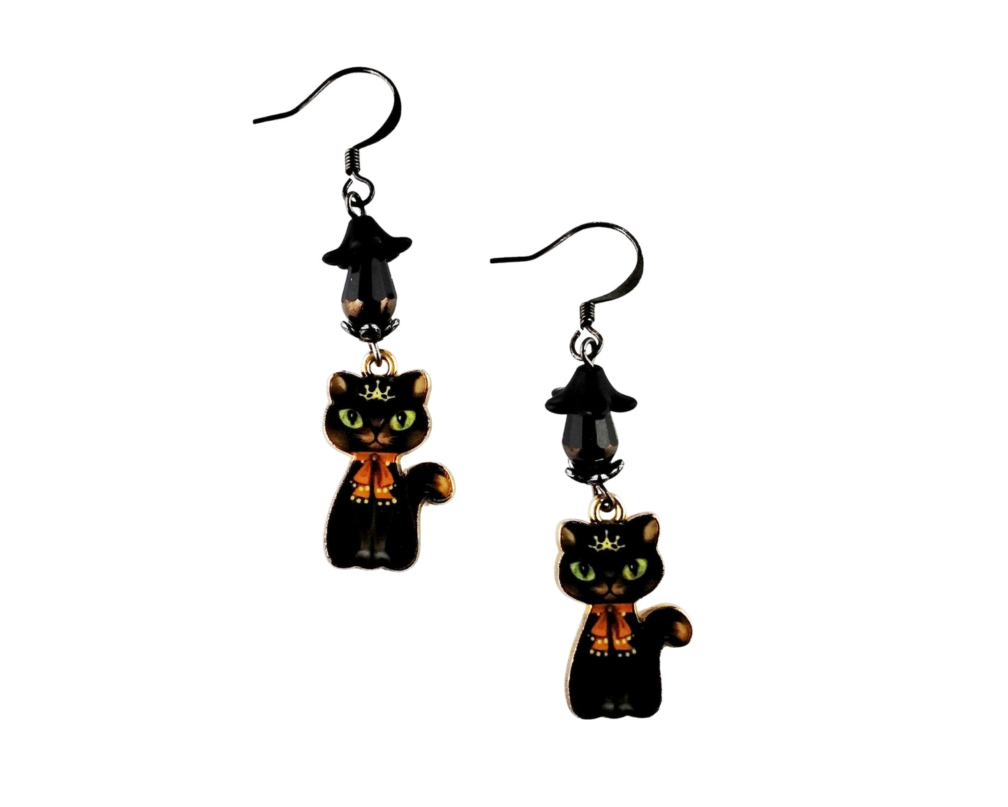 Black cat earrings with orange accents on a white background