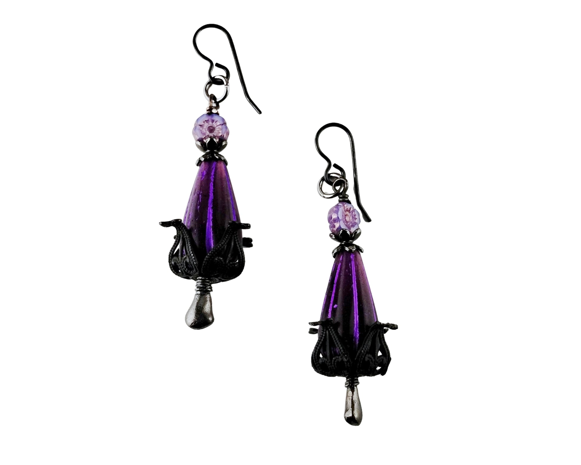 Purple teardrop earrings with black accents on a white background