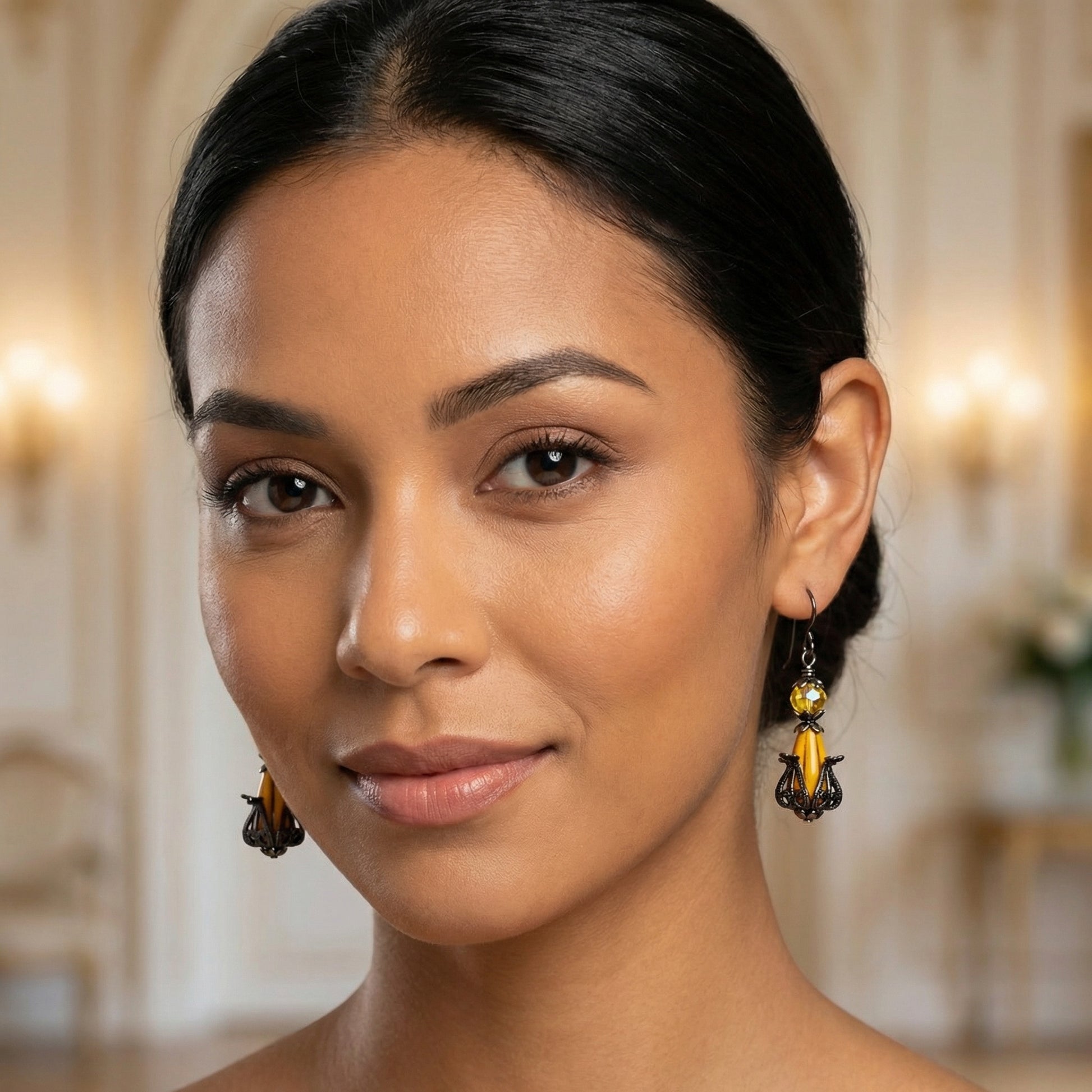 Woman wearing elegant earrings with a blurred background