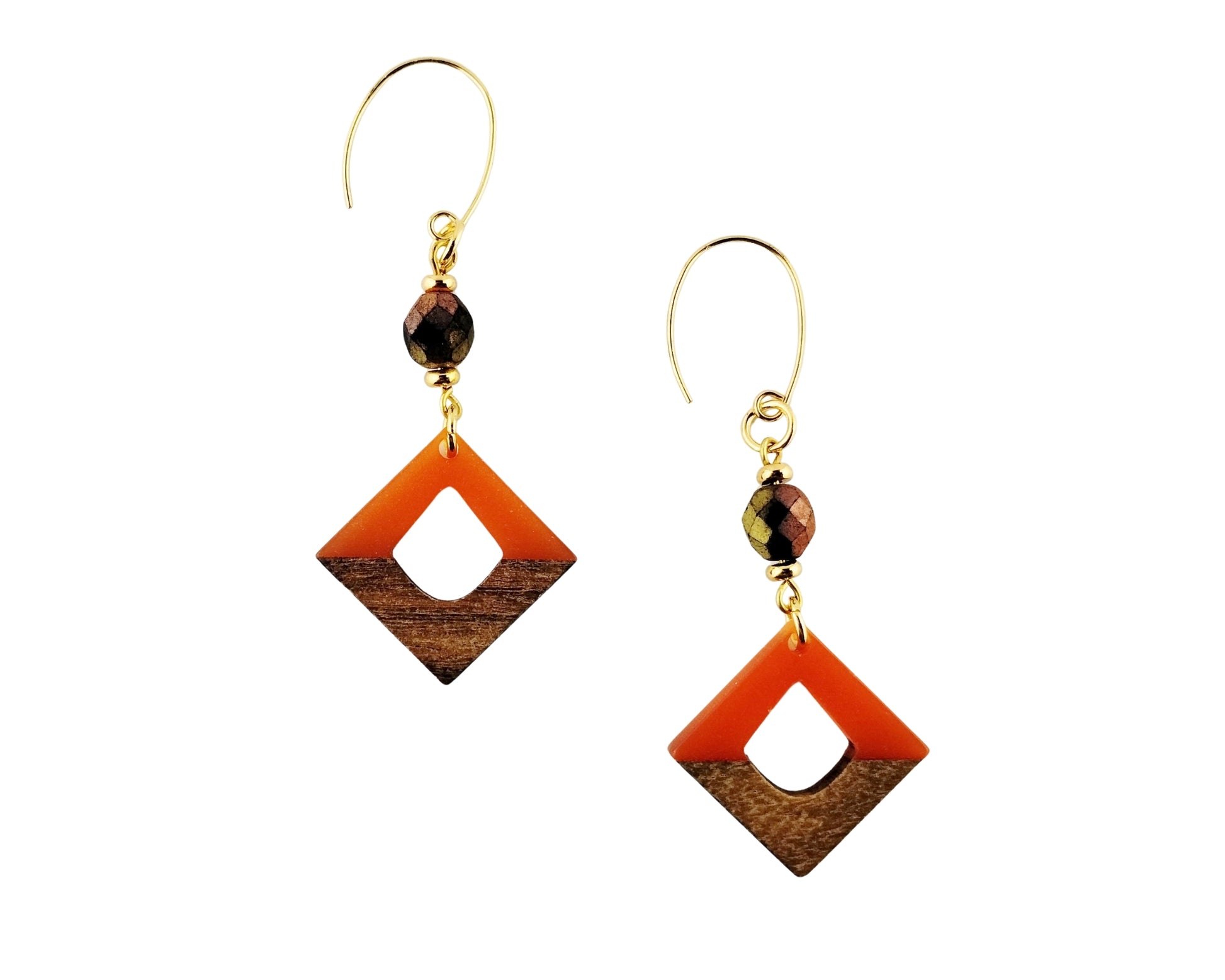 Pair of earrings with orange and brown square designs on a white background