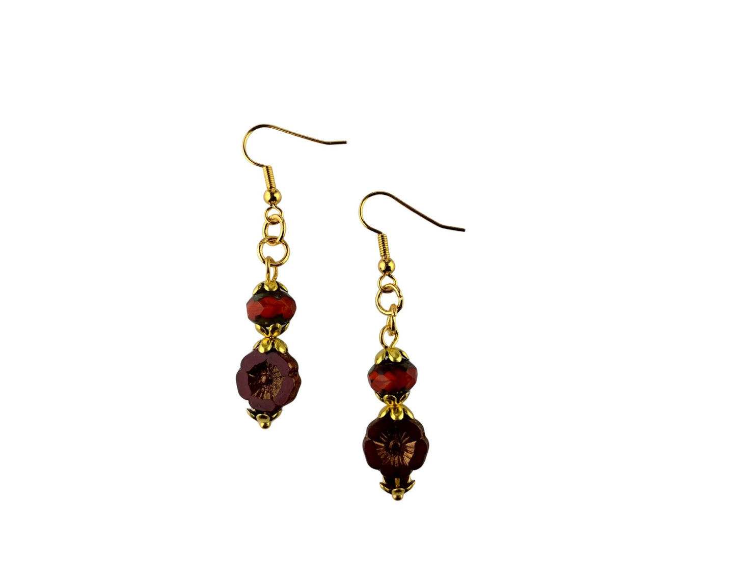 A pair of gold-tone dangle earrings with faceted dark red beads, shown against a plain white background.