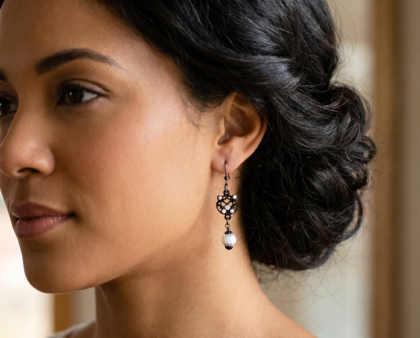 Close-up of a woman wearing an earring with a blurred background