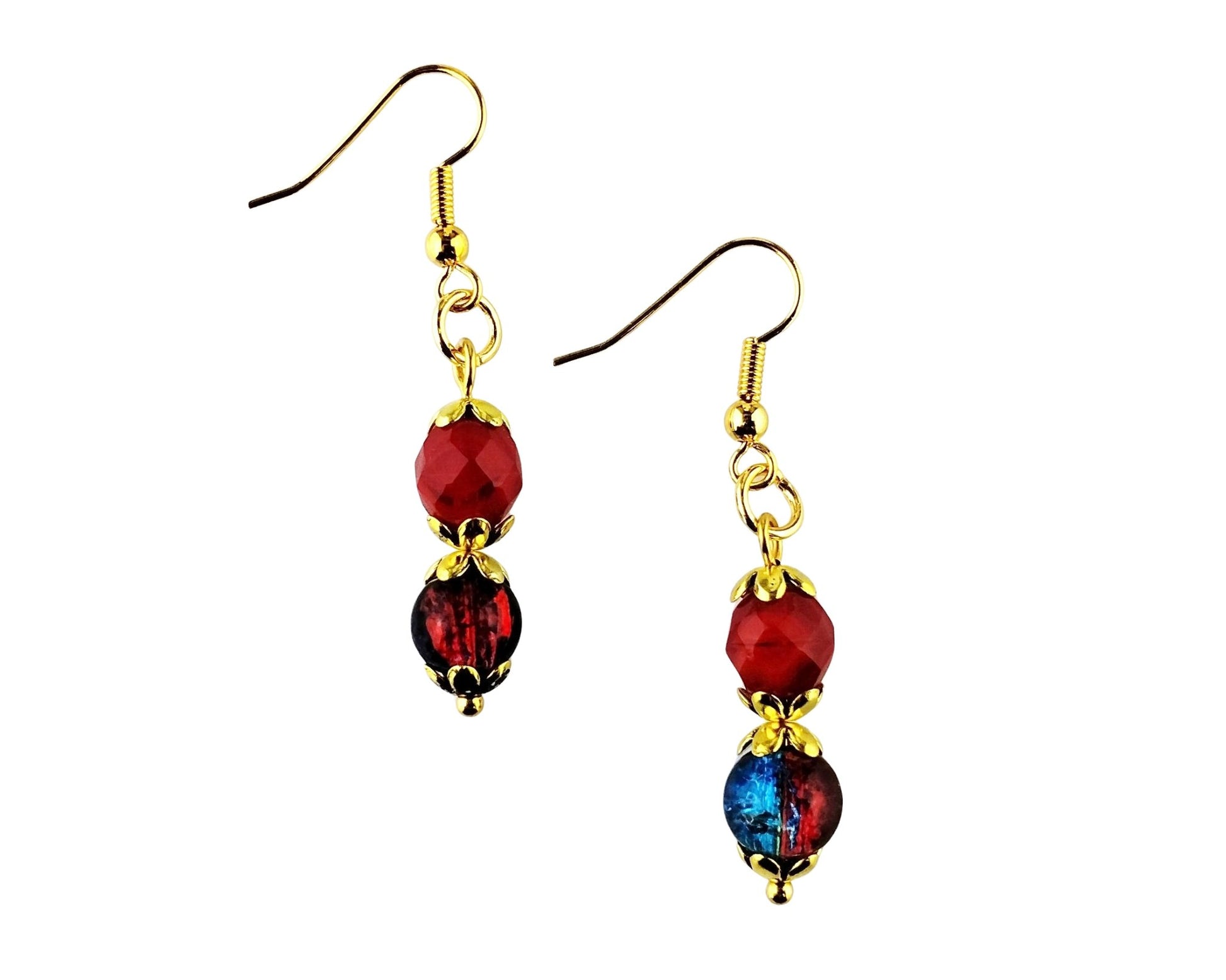 A pair of gold-tone dangle earrings with faceted beads, featuring a red bead, a dark red bead, and a round blue-red iridescent bead on a plain white background.