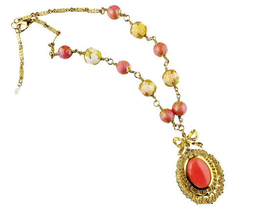 Victorian-inspired gold lace pendant necklace with coral cabochon