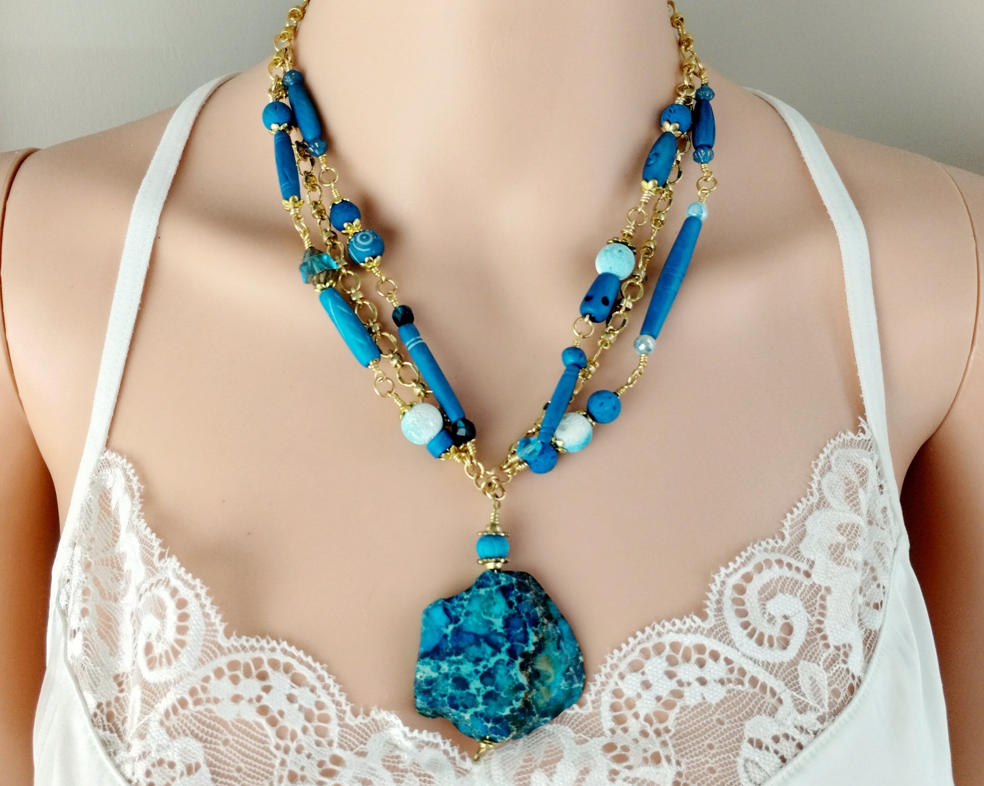 Styled shot of necklace on model, showing layered boho design