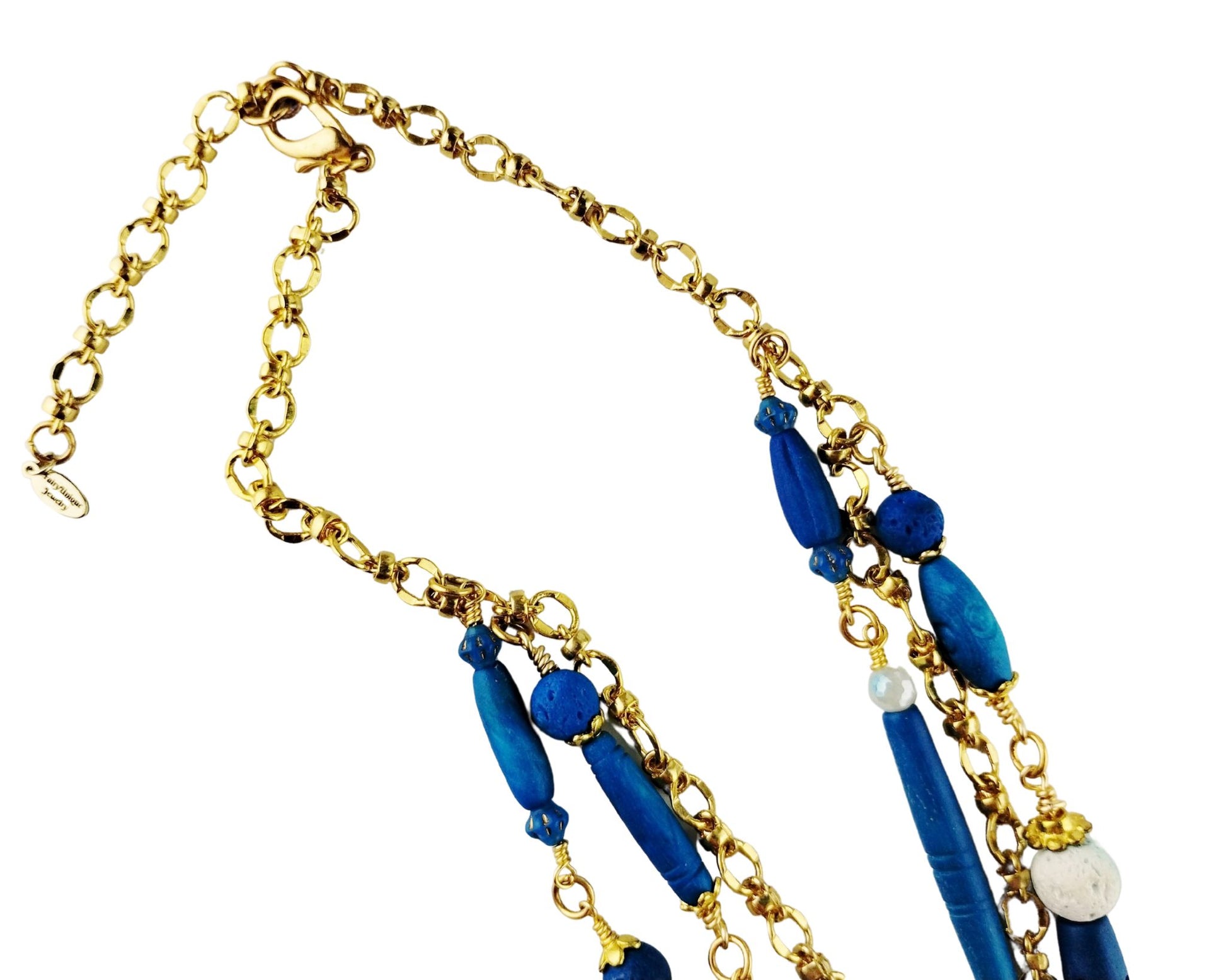Detail of gold-plated lobster clasp and extender chain on handcrafted necklace

