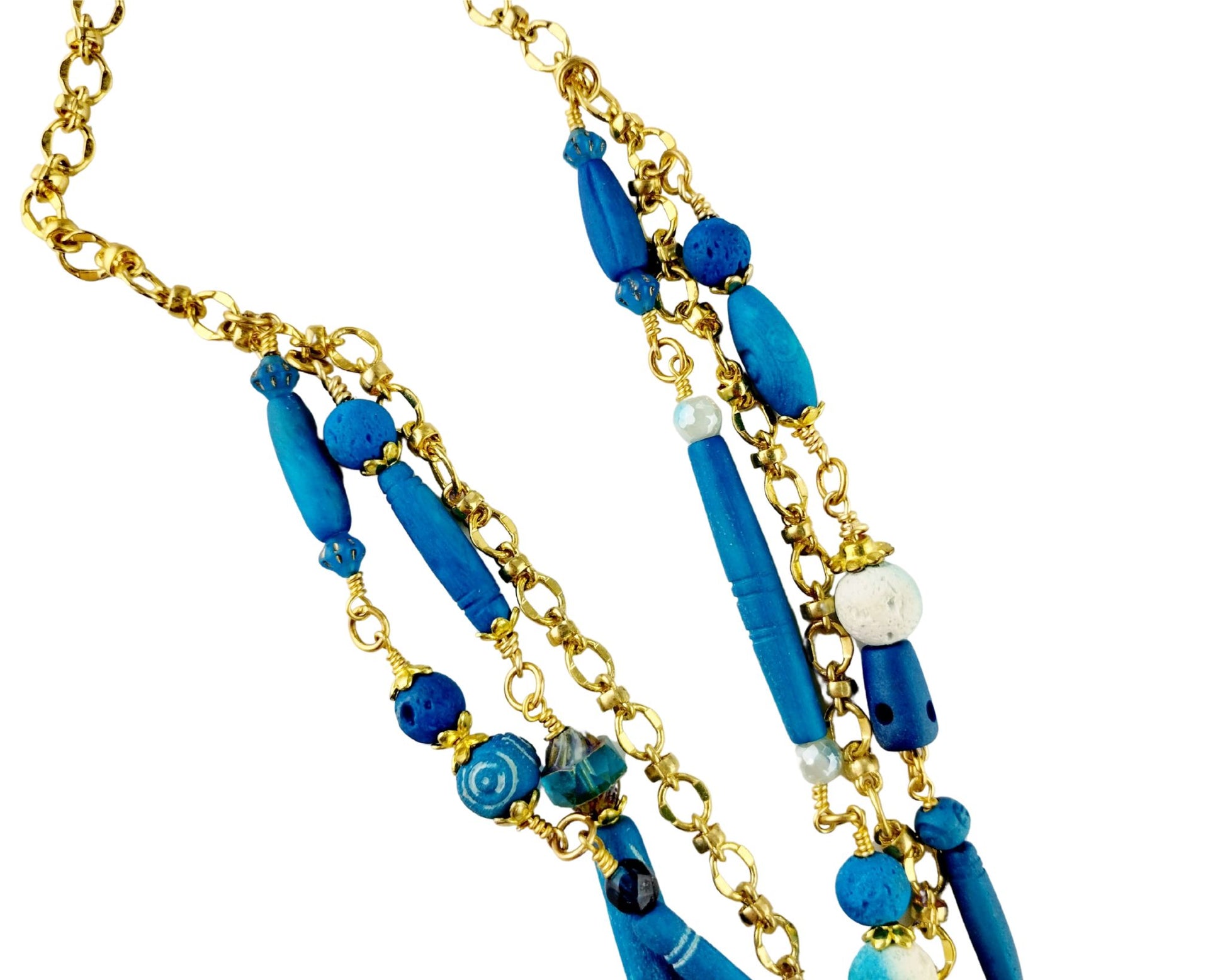 Close-up of dark aqua jasper pendant showing natural texture and shape

