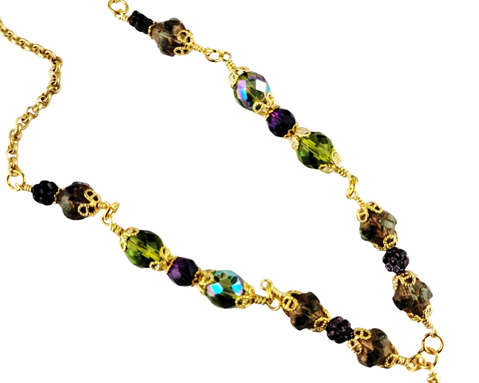 Close-up of serpentine pendant necklace with coordinating olive and eggplant beads.