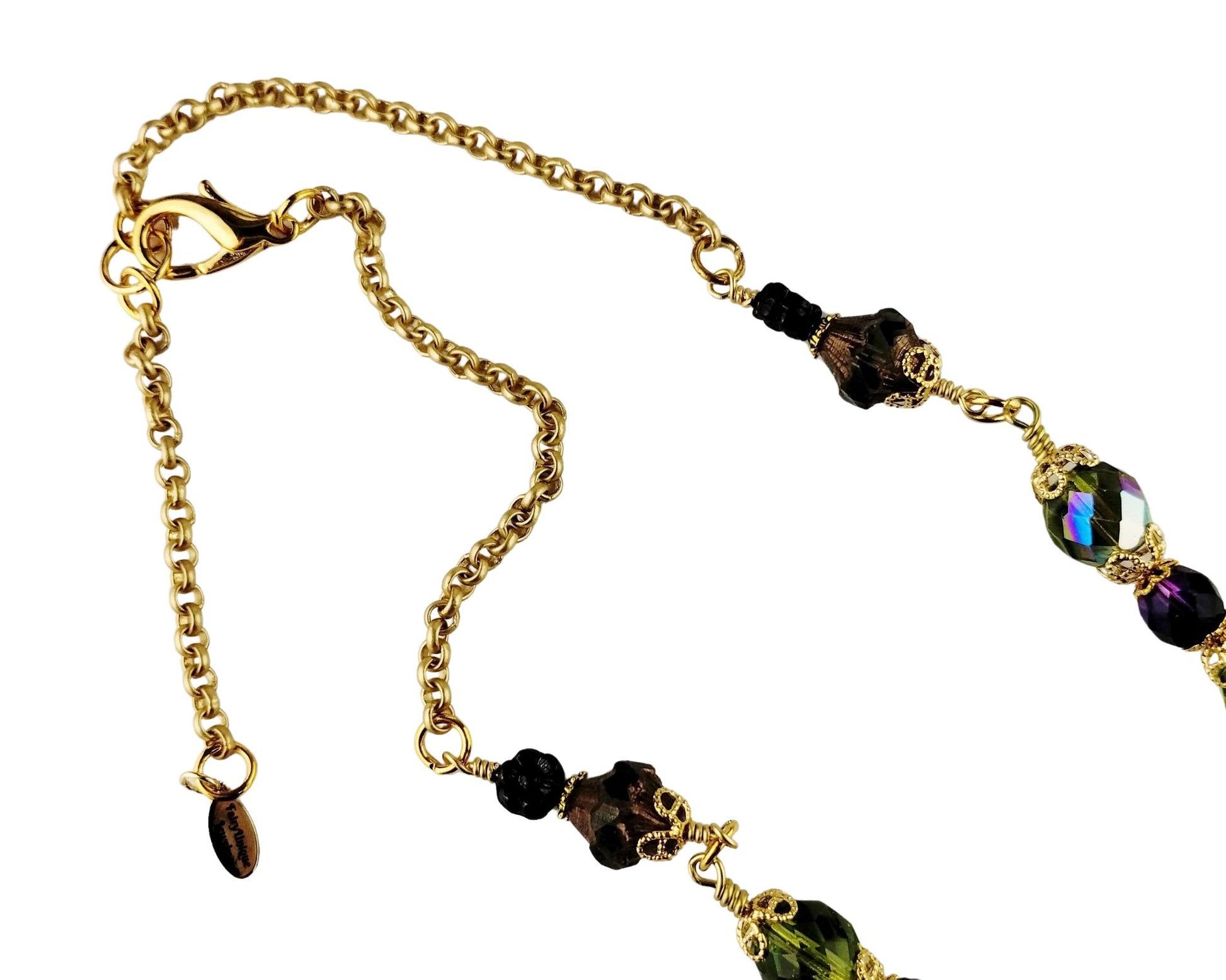 Close-up of serpentine pendant necklace with coordinating olive and eggplant beads.