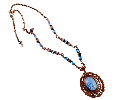 Handmade steel blue and copper necklace with vintage-style floral bead accents.