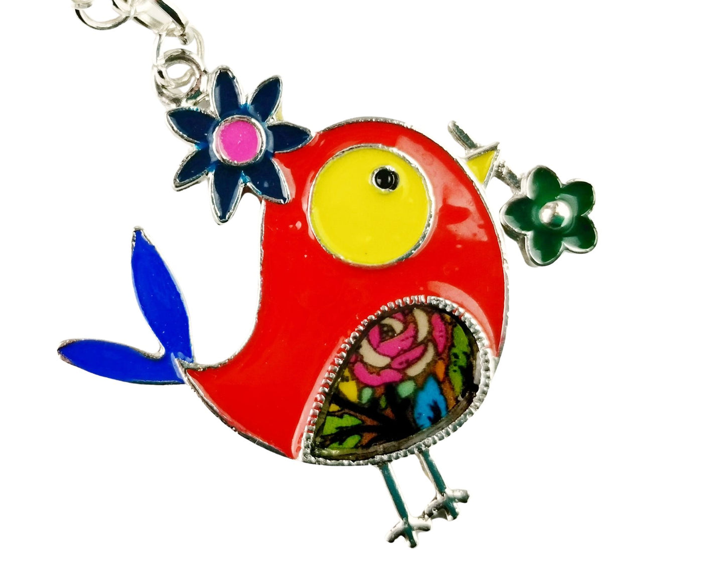 Close-up of bird pendant necklace with red, orange, and yellow bead accents