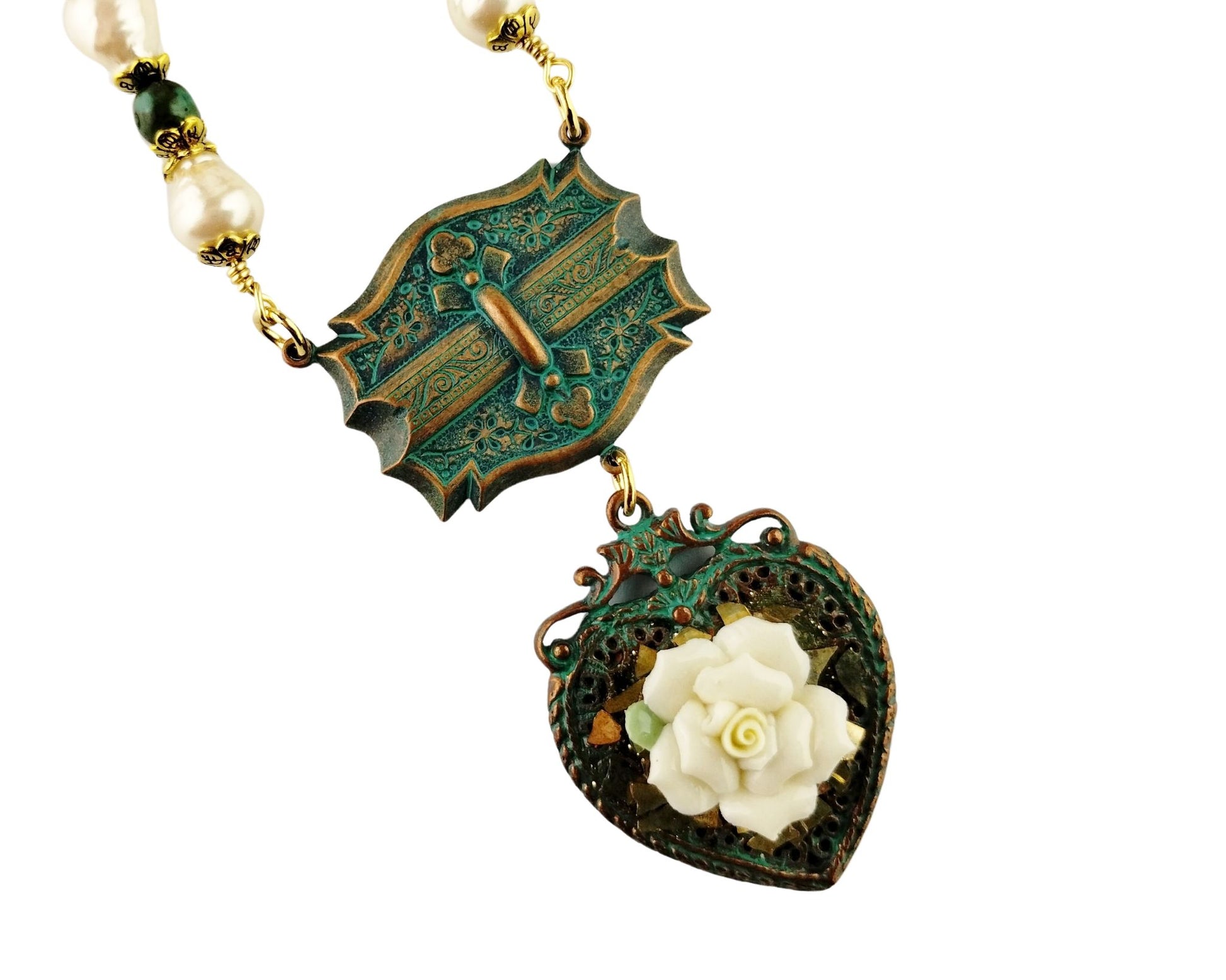 Close-up of heart necklace with aqua copper chain and Celtic connector