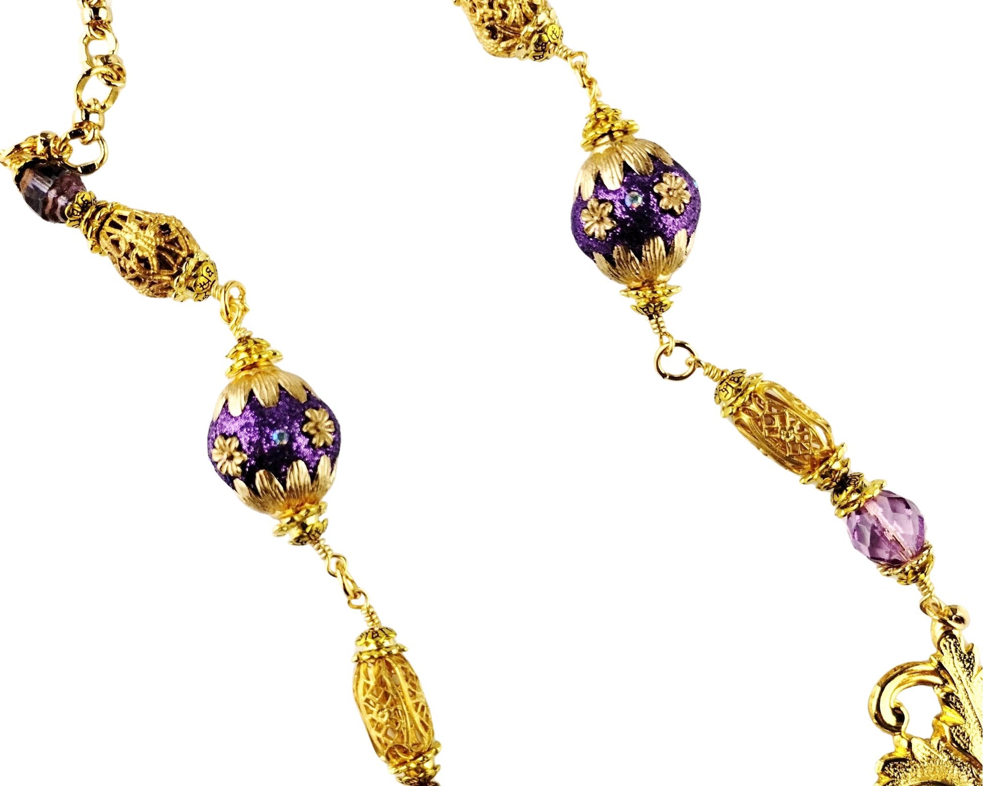 Adjustable gold-plated necklace with purple beads and swag detail