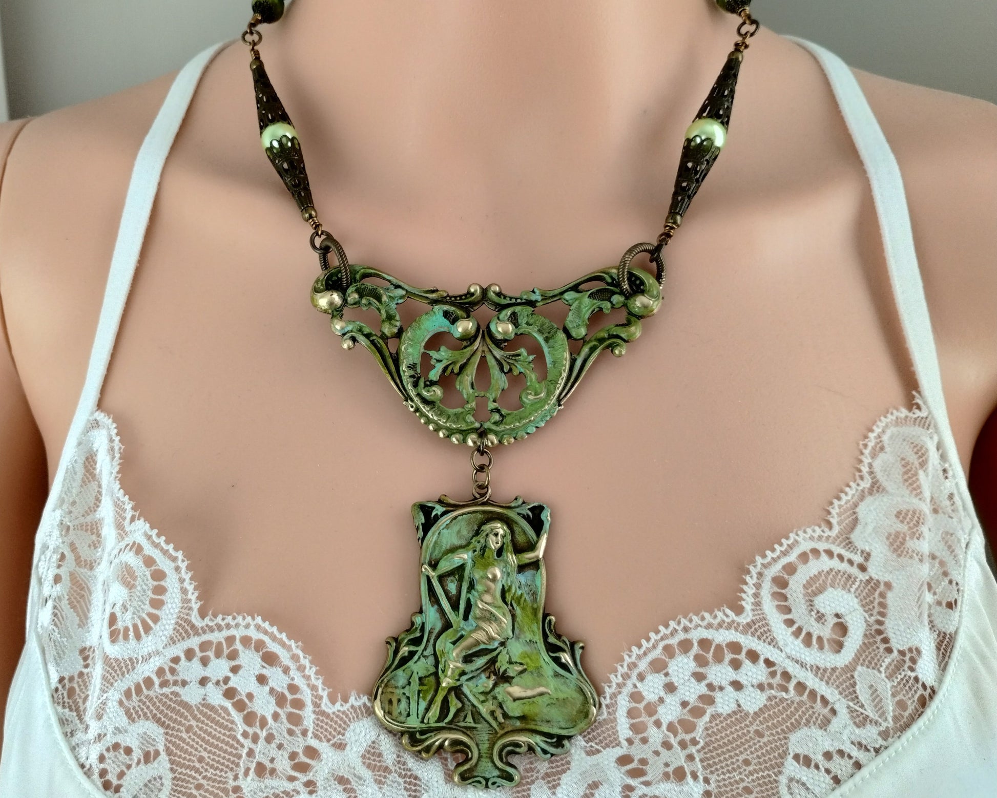 Mythology-inspired jewelry set with brass ox pendant and vintage chain