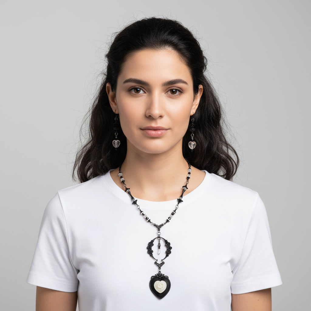 Woman wearing a necklace and earrings on a gray background