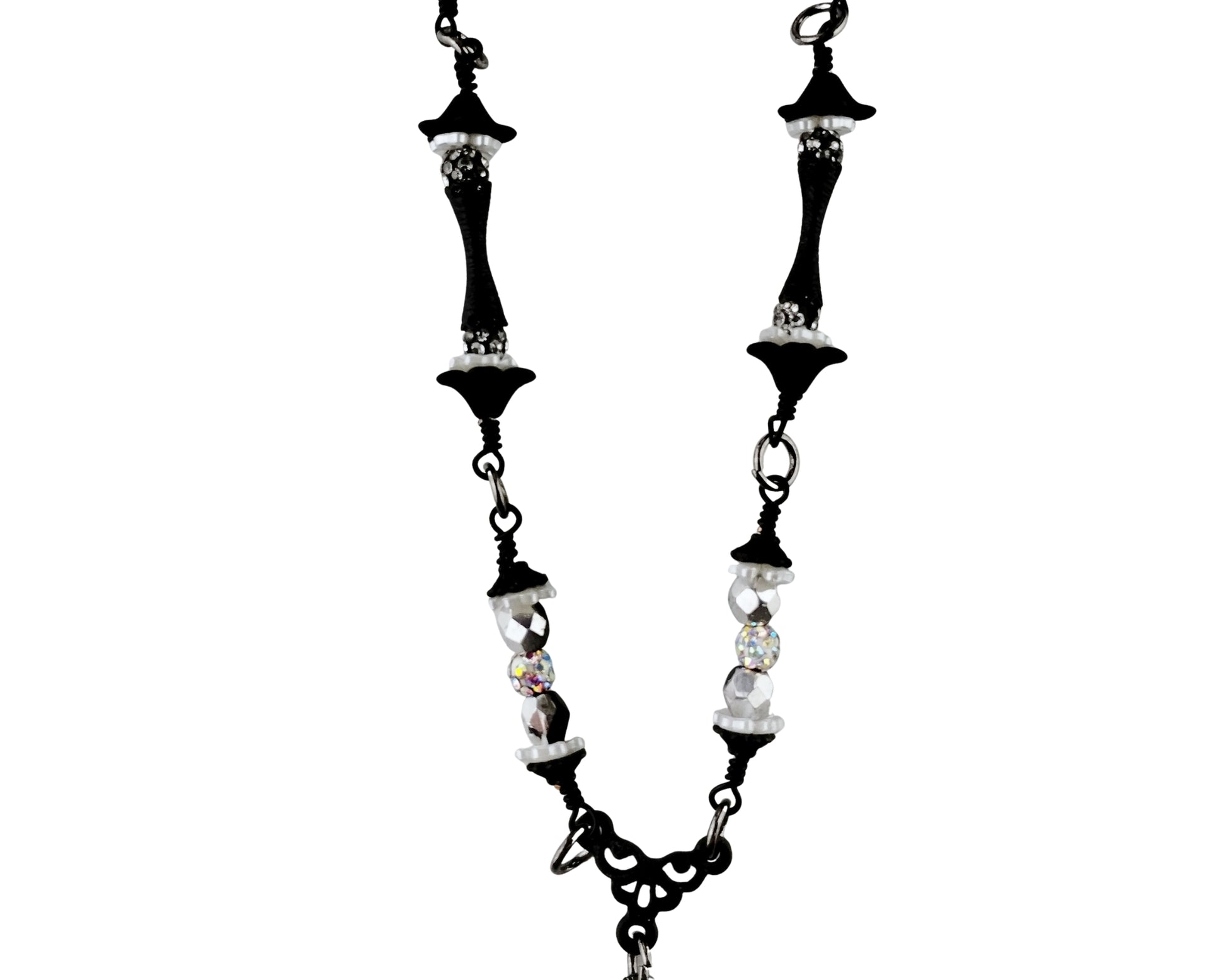Black and white beaded necklace on a white background