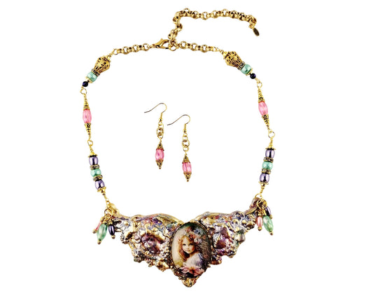 Necklace and earrings set with decorative elements on a white background