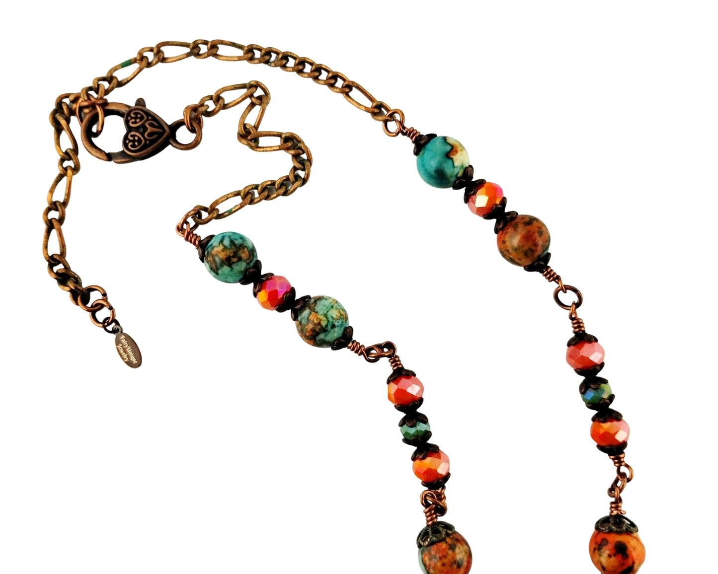 Necklace with multicolored beads and bronze chain on a white background