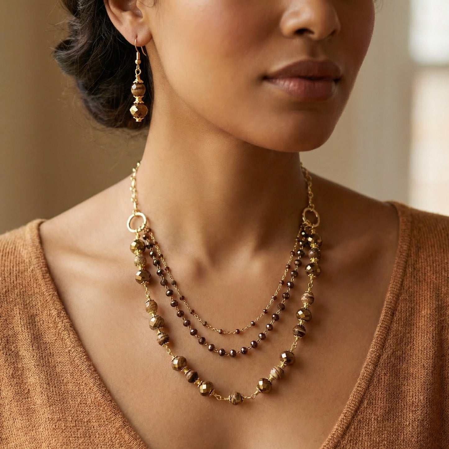 Brown Multi-strand Necklace & Earring on a female model. 