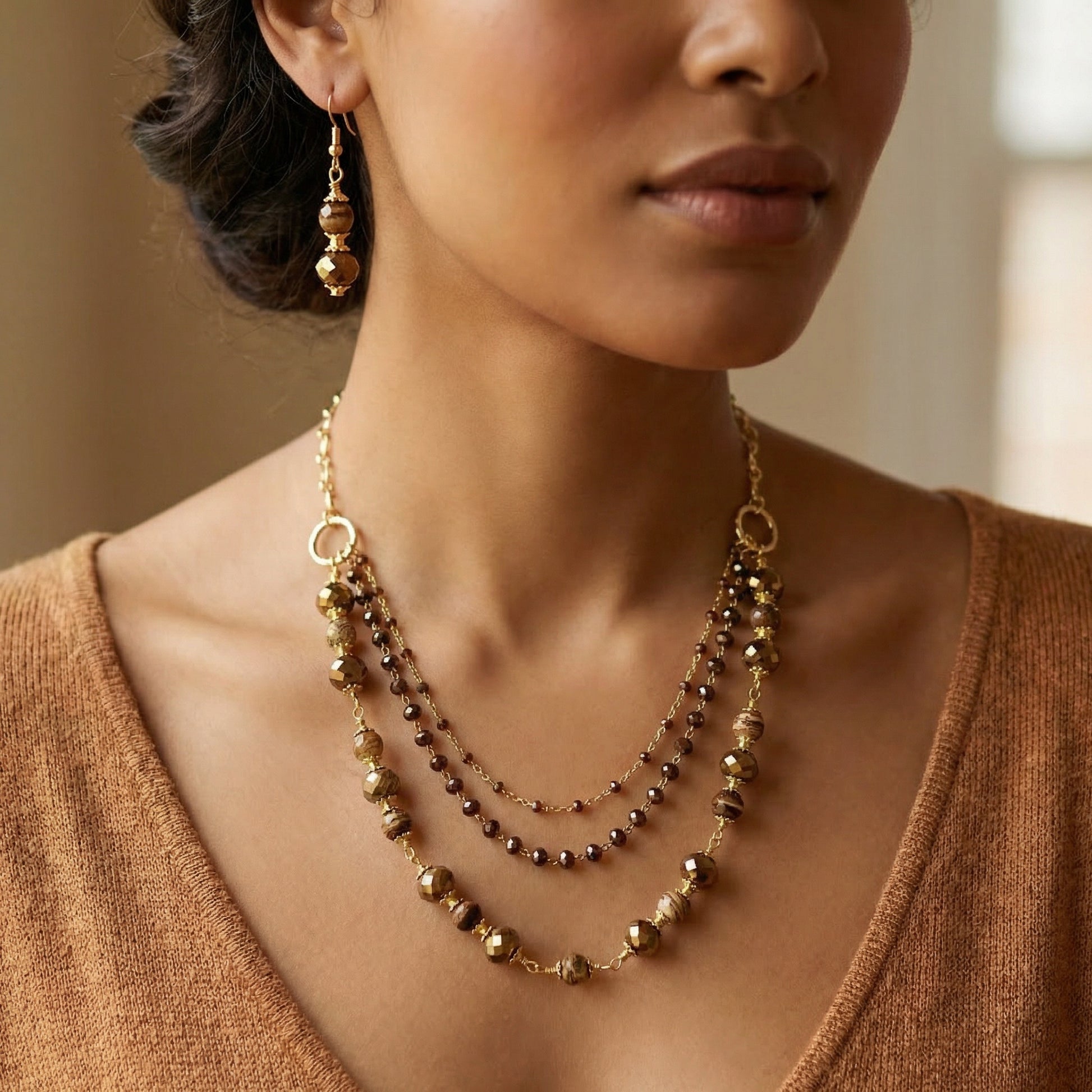 Brown Multi-strand Necklace & Earring on a female model. 