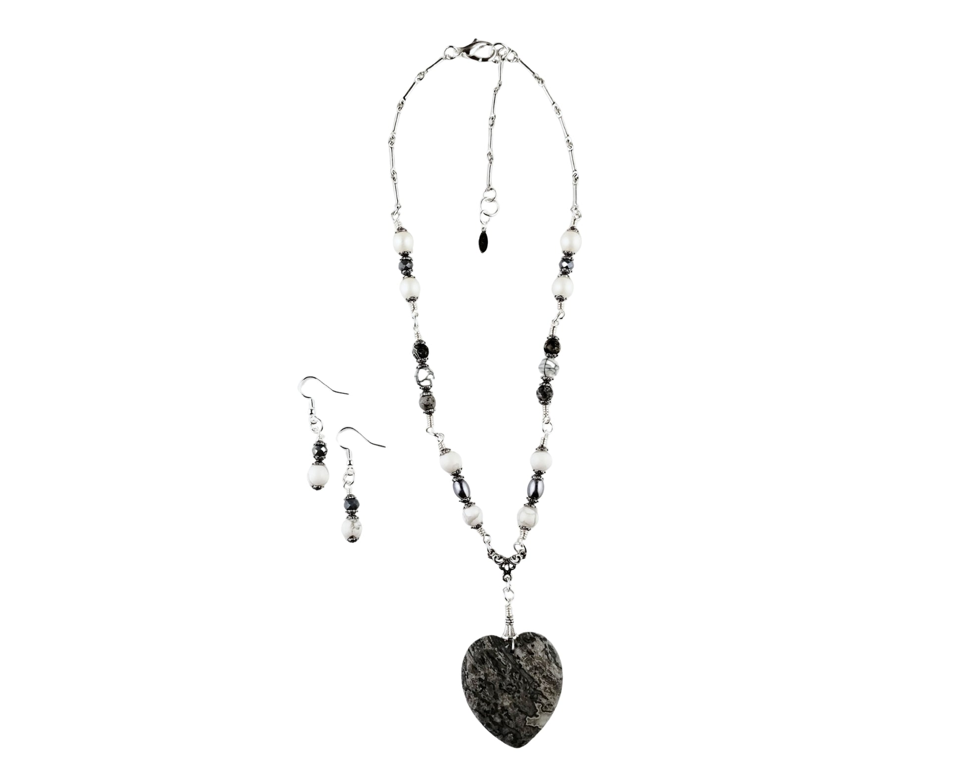 Jewelry set with necklace and earrings on a white background