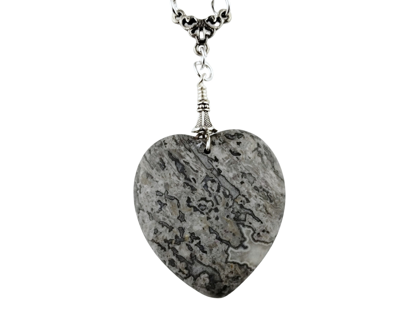 Heart-shaped stone pendant on a white background
