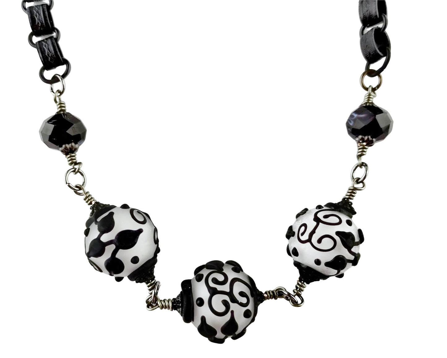 black & white necklace on a white background.