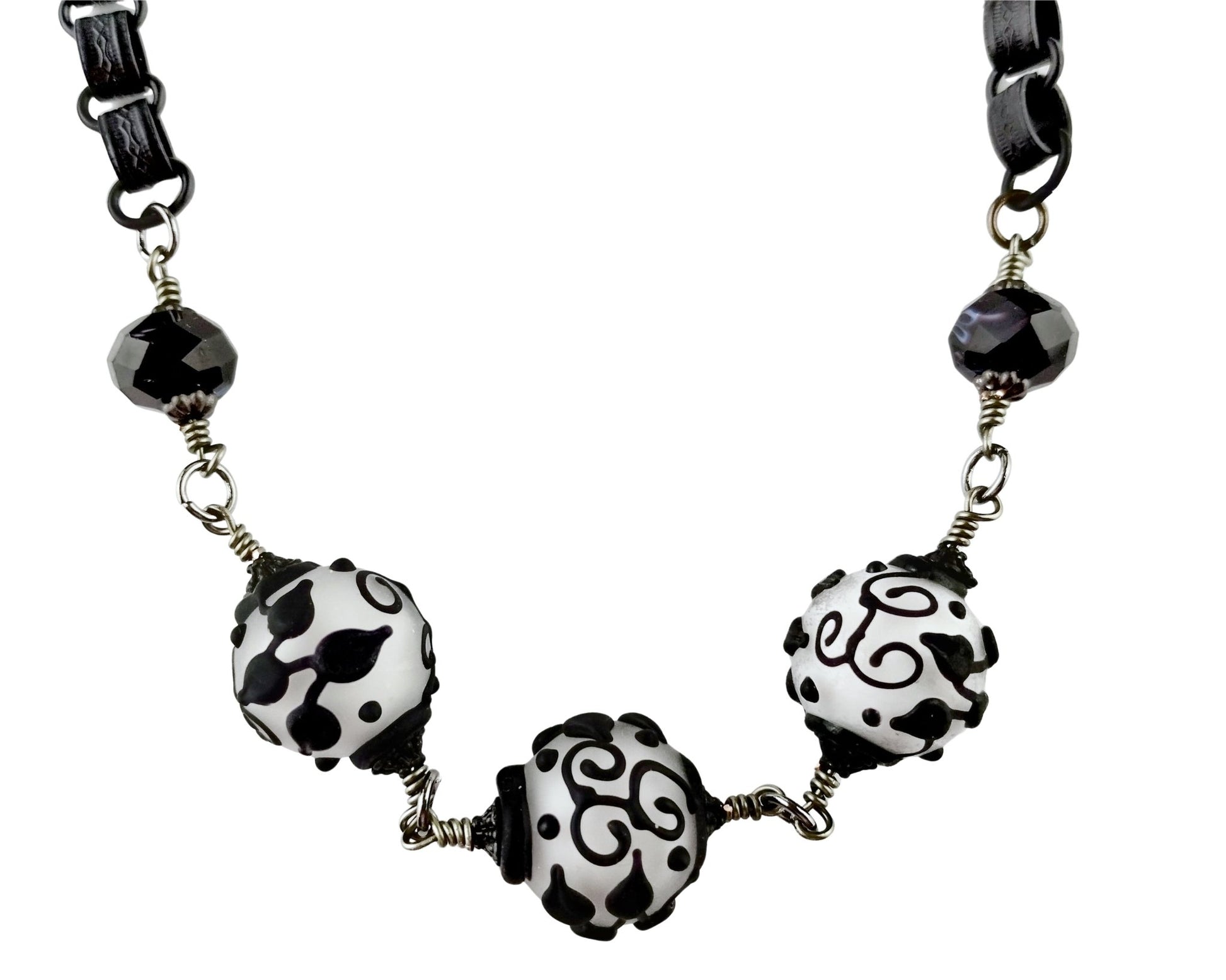 black & white necklace on a white background.