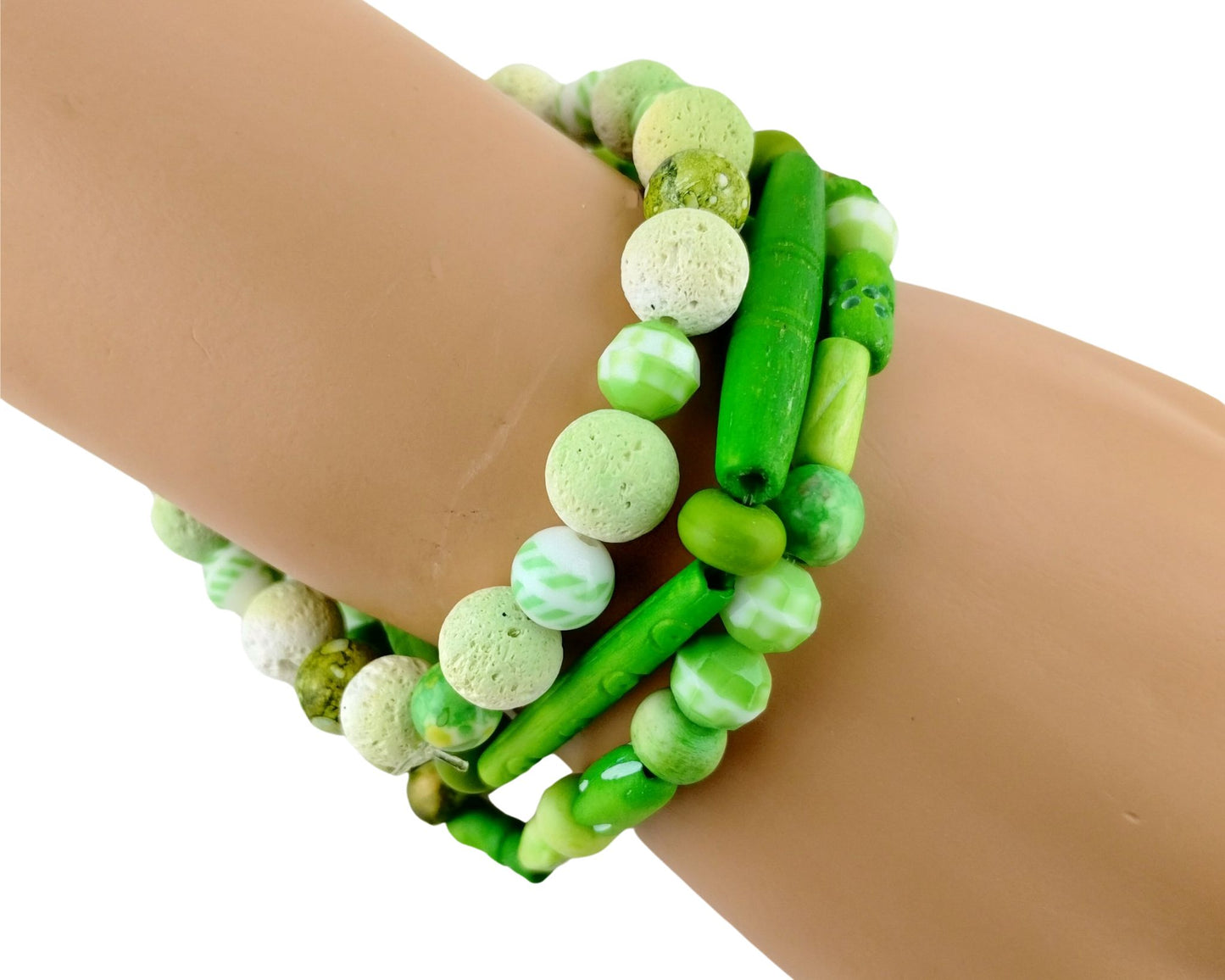 Close-up of lime green beaded bracelet stack showing mix of textures from lava, bone, and glass beads